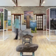 Exhibition space at West Kerry Museum in the centre is an ogham stone on its side. Surrounding this are various interpretative exhibition panels.